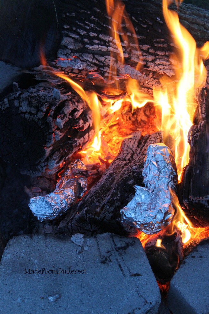 Campfire Banana Boats mummified in the fire. These were a hit at our Memorial Day gathering with friends at the lake. Tutorial from the sisters at MadeFromPinterest