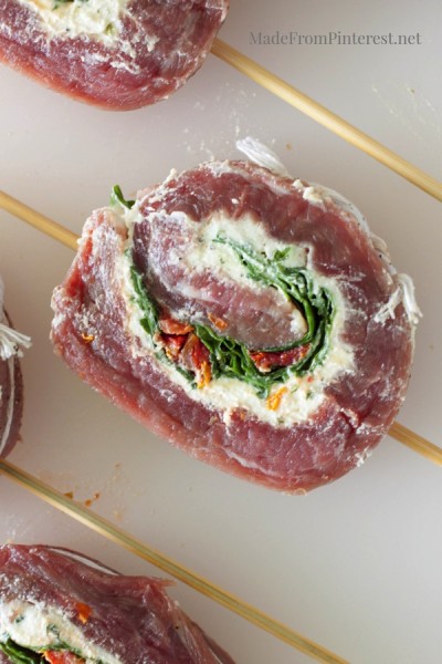 Stuffed Flank Steak Kabobs - Steak rolled with cheese, spinach and sun dried tomatoes.