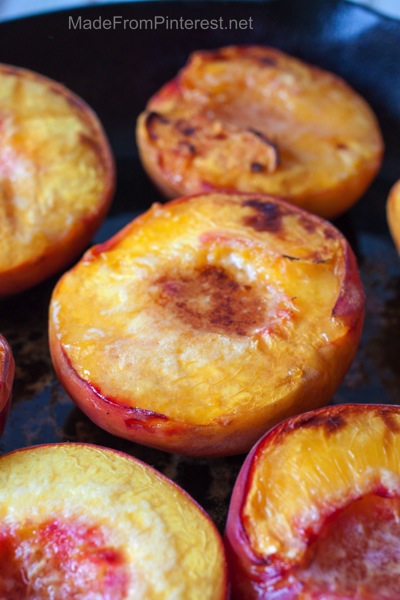 Baked Peaches and Cream - baked to golden brown ready to be topped with marscapone cream sauce and almonds.