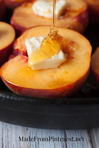 Baked Peaches and Cream - Butter and honey drizzled peaches bake up to perfection and are later topped with cream, cinnamon sugar and almonds!