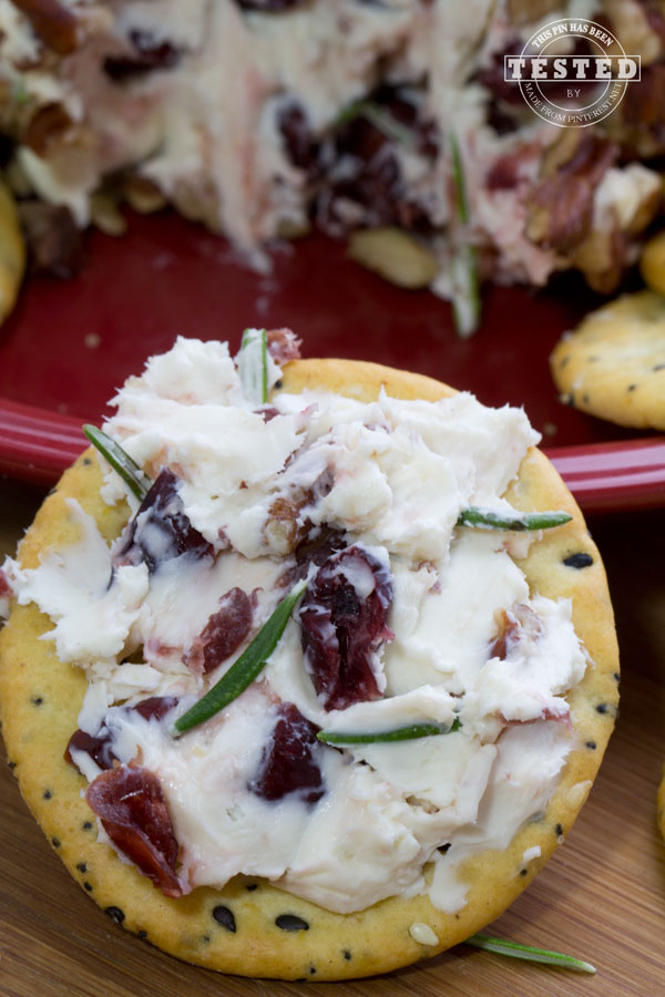 Rosemary and Cranberry Cheese Ball - My goal this holiday season is to find delicious recipes that are quick and easy to make. I'm a big fan of sweet dried cranberries, and I think just about anything tastes better with a little cream cheese. I was surprised to find the recipe calls for garlic salt. The combination of the garlic salt and rosemary and pecans give this spread a rich, robust flavor. Serve this spread with bagel chips or your favorite crackers, it's a great addition to any celebration or perfect for a decadent afternoon snack!