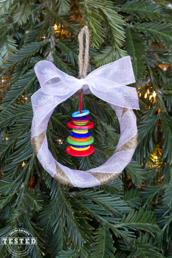 Mason Jar Ring Ornament - Making this rustic Mason Jar ring ornament is a quick and easy Christmas project. They look lovely on a tree, or used to adorn wrapped gifts!