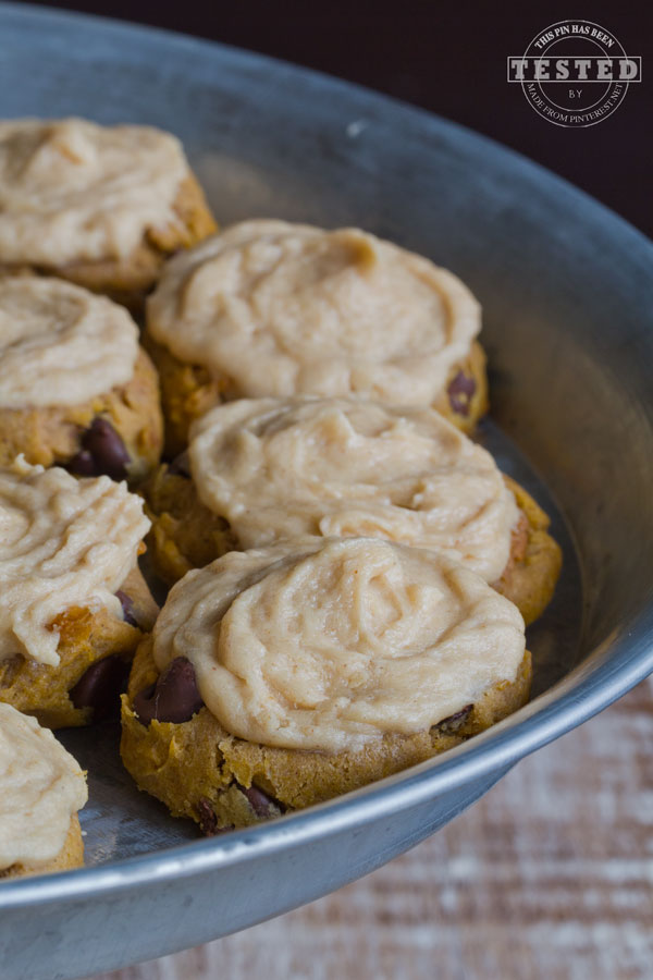 Peanut Butter Pumpkin Cookies - Peanut butter, pumpkin and chocolate chips come together in a moist, rich, chewy cookie to good to resist. Topped with creamy peanut butter, cream cheese frosting for the ultimate cookie experience!