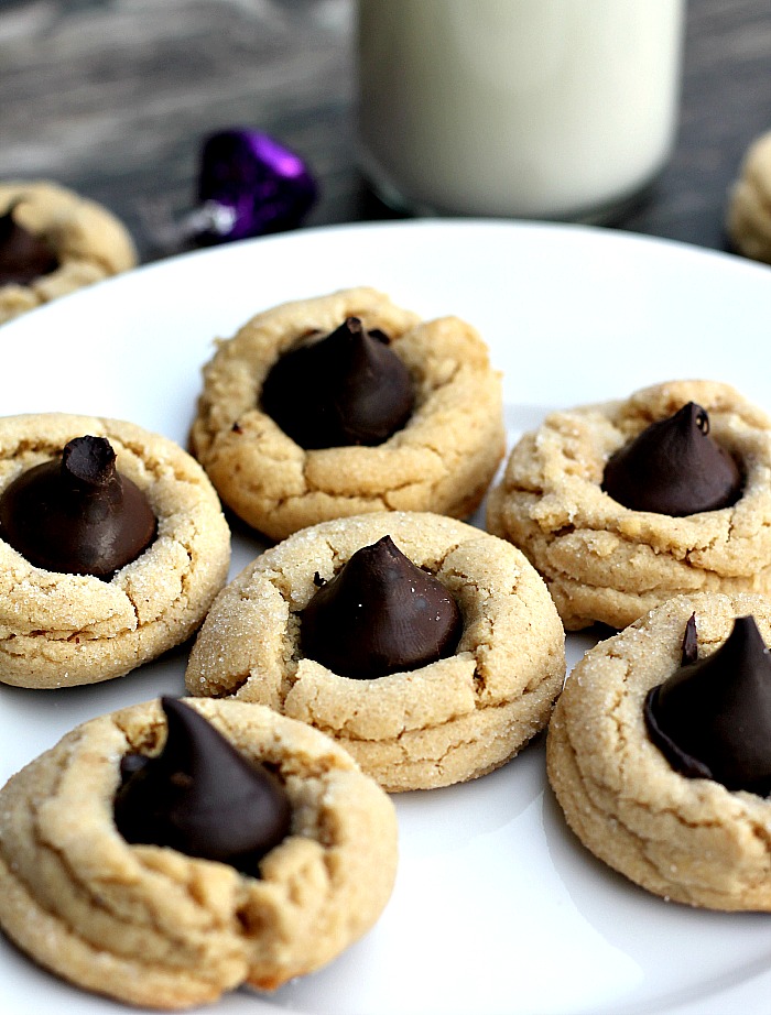 White Chocolate Peanut Butter Kiss Cookies| Soft white chocolate peanut butter cookies complimented with a dark chocolate kiss.
