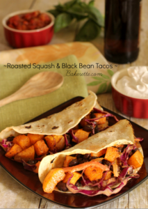 Roasted Squash & Black Bean Tacos - These tacos are full of fresh ingredients like earthy butternut squash, black beans and a bright, spicy, garden slaw to drive up the heat.