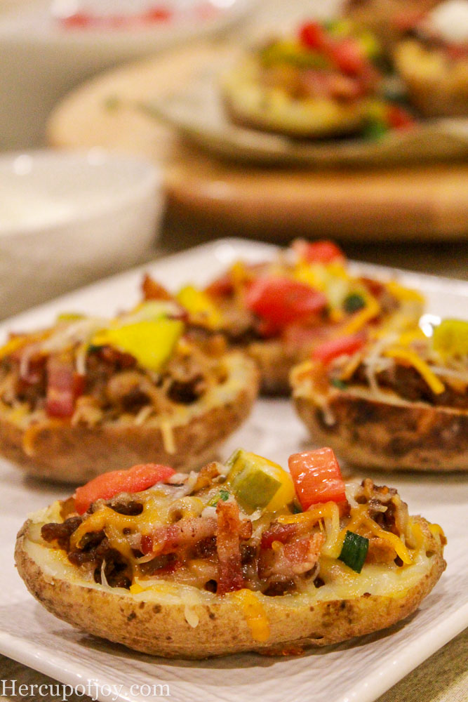 Cheeseburger Stuffed Potatoes - These bacon cheeseburger stuffed potatoes are the ultimate burger and fries meal combined into one dish! 