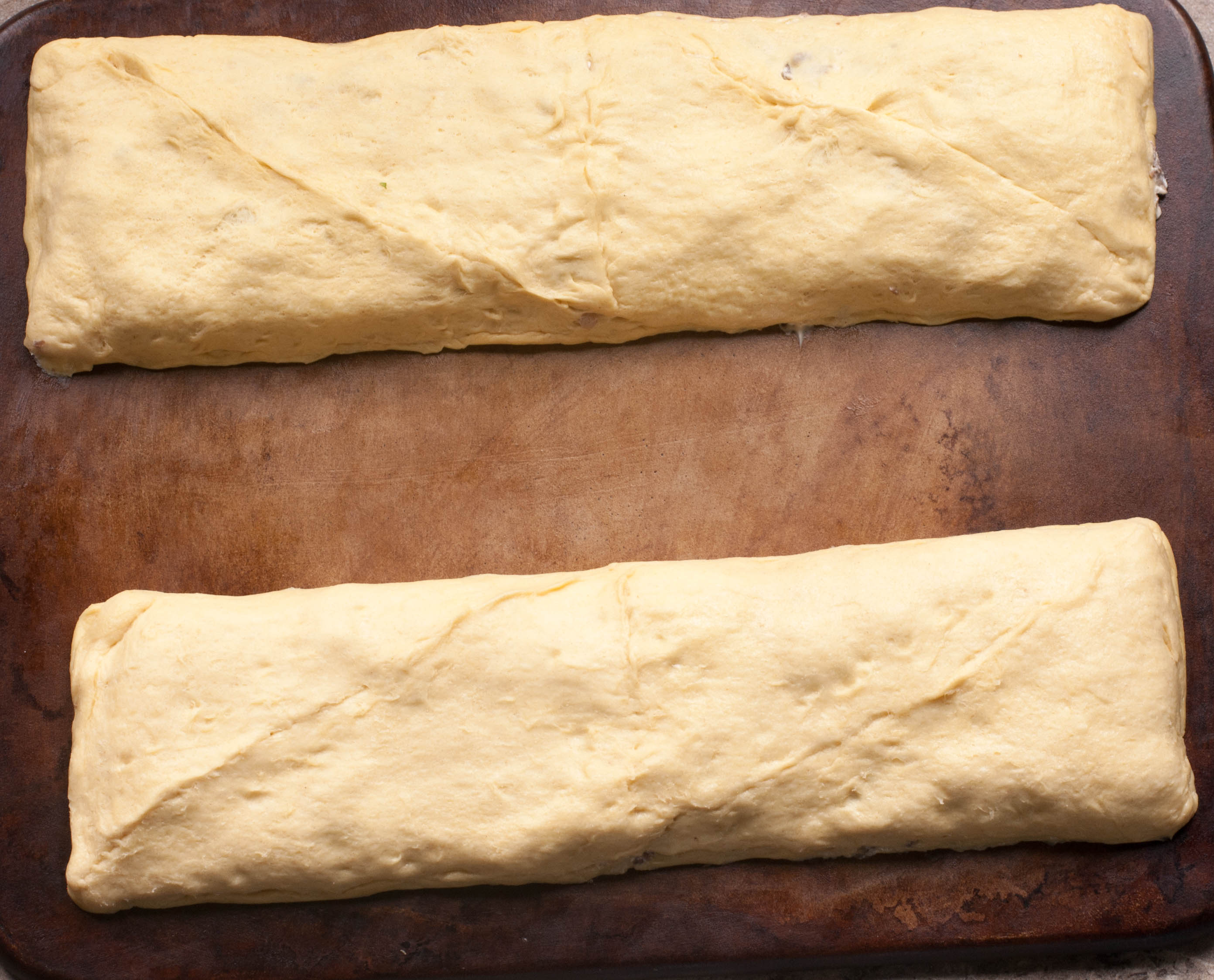 Prepping the cream cheese and sausage filling in Pillsbury Crescent dough  sheets - The Southerly Magnolia