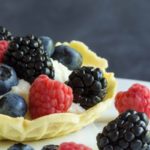 Mascarpone cream filled pizzelle cups topped with berries. Now that's a summer dessert!