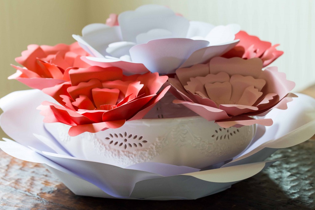 Easy paper flowers make a beautiful centerpiece. These would be  great for garden parties, little girls rooms, and photo backdrops.