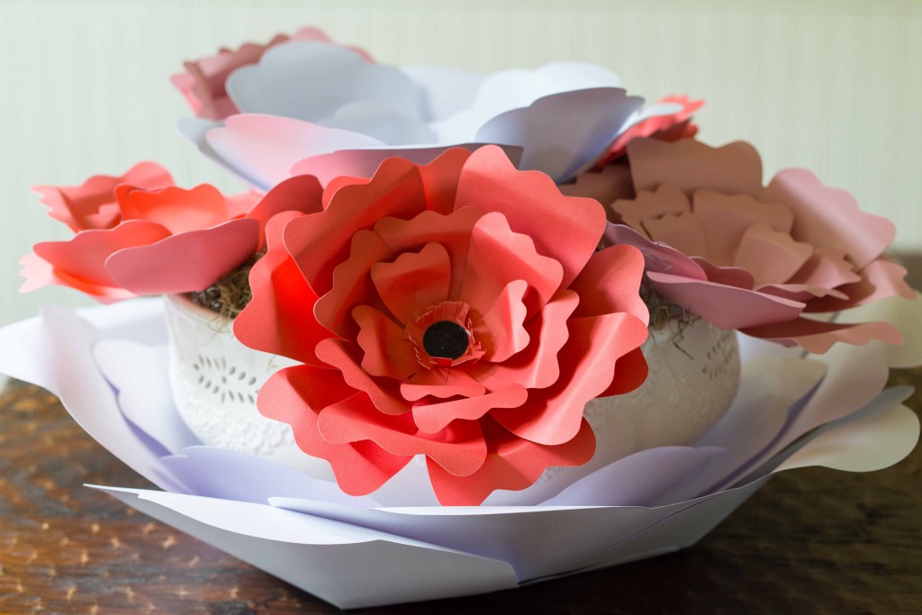 Easy paper flowers make a beautiful centerpiece. These would be  great for garden parties, little girls rooms, and photo backdrops.