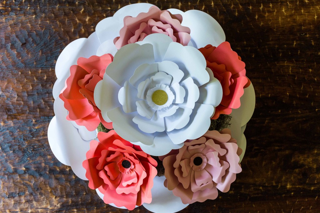 Easy paper flowers make a beautiful centerpiece. These would be great for garden parties, little girls rooms, and photo backdrops.