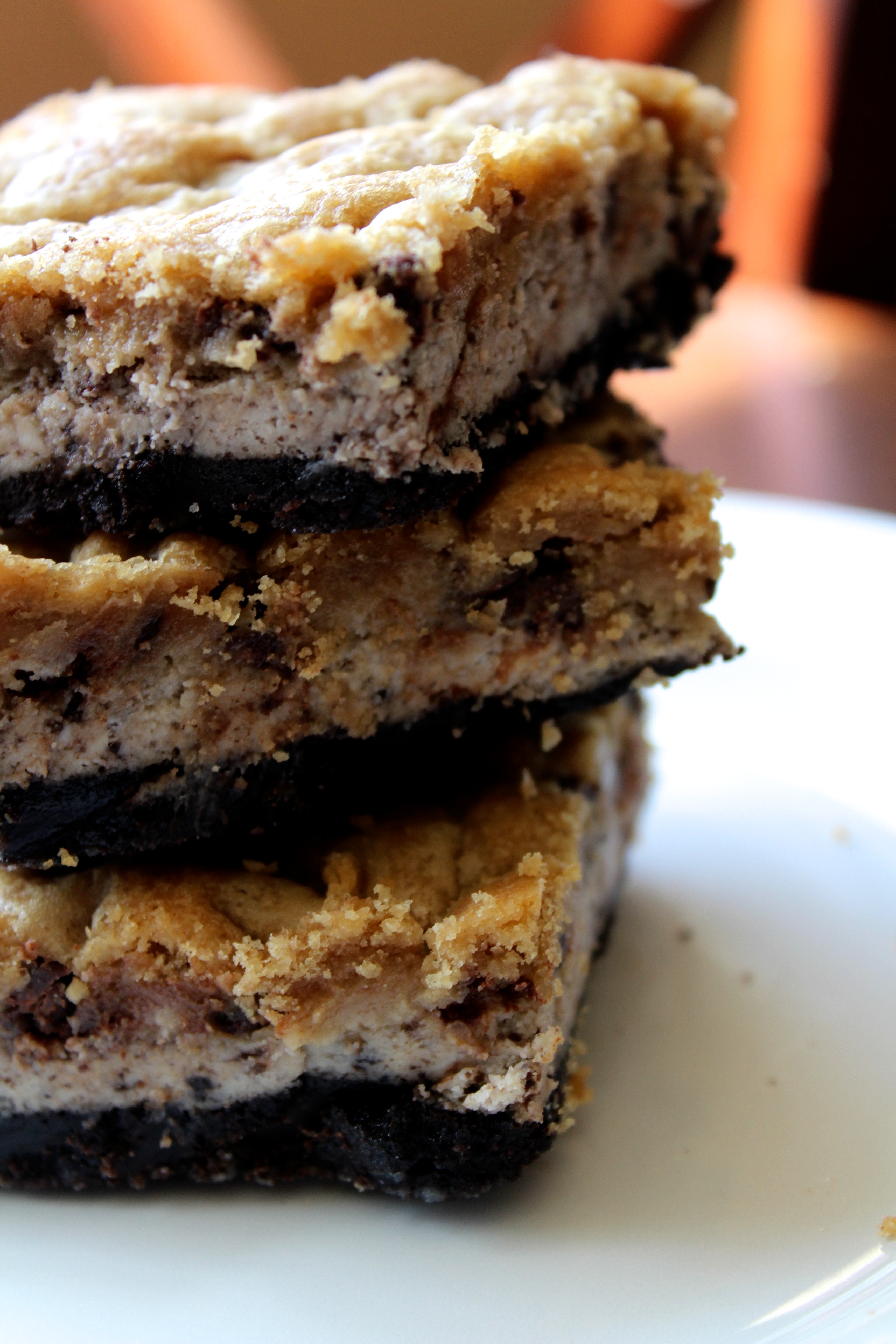 Awesome and easy recipe for layered cookie cough cheesecake bars! The cheesecake, Oreo and cookie layers blended together perfectly!