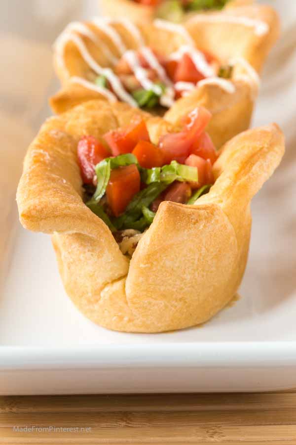 Don't pull out another tired frozen dinner. You can make these in the time it takes to get a pizza delivered! And you can make your own frozen dinner with these crescent roll cups filled with swiss cheese, chicken and bacon filling and topped with lettuce and tomato. These Chicken Cordon Bleu BLT Cups are AMAZING! A little drizzle of homemade dressing is the perfect finish. 