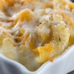 Macaroni and Cheeses - Seven different kinds of cheese are used to create this incredible dish! Sharp yellow Cheddar, extra-sharp white Cheddar, Mozzarella, Asiago, Gruyere, Monterey Jack, Muenster and Velveeta. Eggs, half and half, butter, and bread crumbs are added to make this the creamiest macaroni and cheese I have ever had the pleasure of eating. This is comfort food at it's all time best!