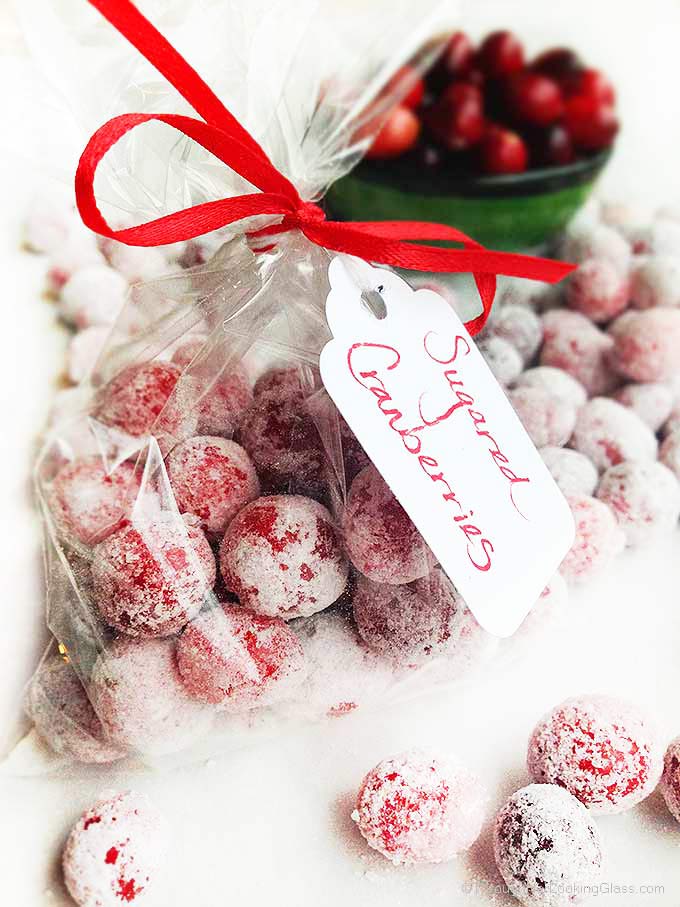 Festive Sugared Cranberries. Bursting w/flavor that pops in your mouth. Sweet & tart. Tangy & addictive. Perfect garnish, snack, stocking stuffer and gift.