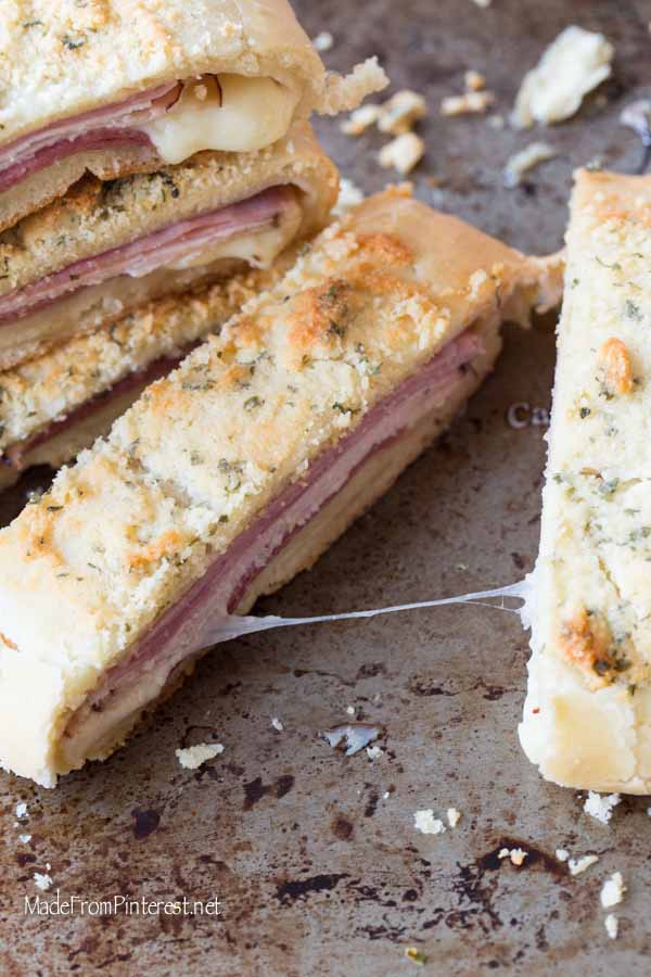 This recipe is so beloved in our family because it is easy to make and tastes just as good next day hot or cold. My son used to love Stromboli for his school lunches. The key to this Stromboli is the order you lay the meats. We always do ham, turkey, cheese, then salami. When it cooks up the ham and salami flavor the bread and taste amazing. The crunchy parmesan topping tastes as good as it looks, I promise!