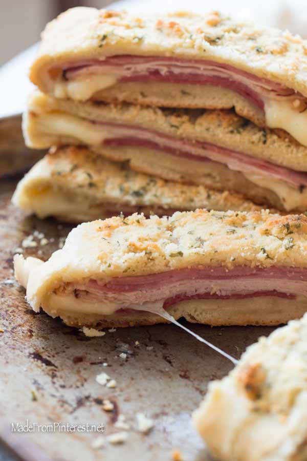 This recipe is so beloved in our family because it is easy to make and tastes just as good next day hot or cold. My son used to love Stromboli for his school lunches. The key to this Stromboli is the order you lay the meats. We always do ham, turkey, cheese, then salami. When it cooks up the ham and salami flavor the bread and taste amazing. The crunchy parmesan topping tastes as good as it looks, I promise!