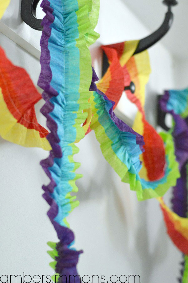 DIY Ruffled Streamers Tutorial by Amber Simmons of ambersimmons.com | These easy handmade party decorations add a little something extra to any occasion. Make for birthdays, holidays, the Superbowl, or make them in your favorite colors for everyday decor. They also make super cute backdrops for all your special photos.