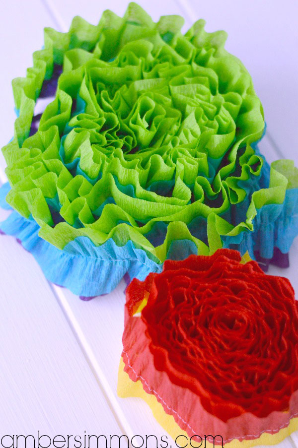DIY Ruffled Streamers Tutorial by Amber Simmons of ambersimmons.com | These easy handmade party decorations add a little something extra to any occasion. Make for birthdays, holidays, the Superbowl, or make them in your favorite colors for everyday decor. They also make super cute backdrops for all your special photos.