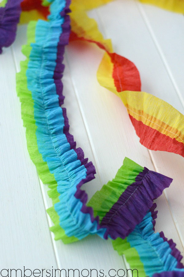 DIY Ruffled Streamers Tutorial by Amber Simmons of ambersimmons.com | These easy handmade party decorations add a little something extra to any occasion. Make for birthdays, holidays, the Superbowl, or make them in your favorite colors for everyday decor. They also make super cute backdrops for all your special photos.