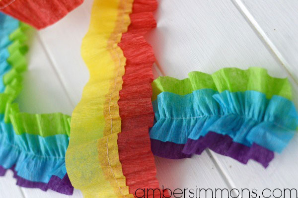 DIY Ruffled Streamers Tutorial by Amber Simmons of ambersimmons.com | These easy handmade party decorations add a little something extra to any occasion. Make for birthdays, holidays, the Superbowl, or make them in your favorite colors for everyday decor. They also make super cute backdrops for all your special photos.