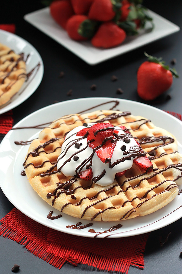 Shortcut to deliciousness, quick and easy Strawberry Waffle Cakes, layered with fresh strawberries, coconut cream and chocolate. A new way to use your box cake mix.