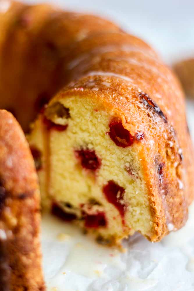 This Cranberry Orange Pound Cake is an easy holiday dessert. The orange citrus is a subtle flavor to compliment the tiny red bursts of Christmas joy!