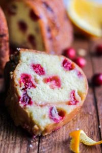 This Cranberry Orange Pound Cake is an easy holiday dessert. The orange citrus is a subtle flavor to compliment the tiny red bursts of Christmas joy!