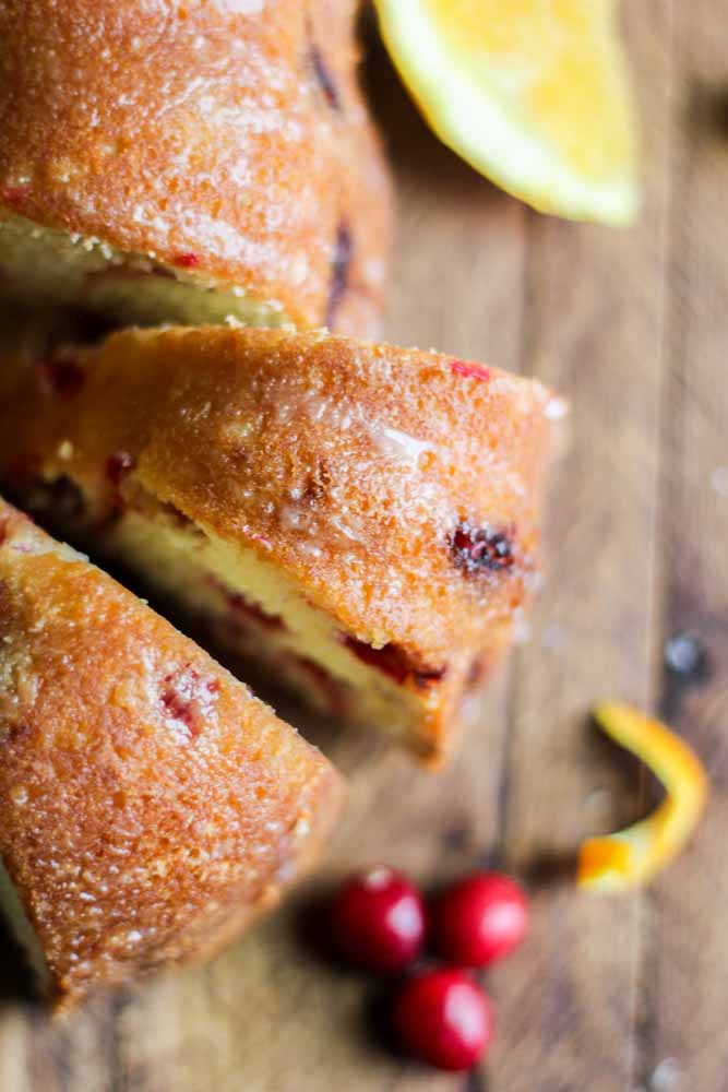 This Cranberry Orange Pound Cake is an easy holiday dessert. The orange citrus is a subtle flavor to compliment the tiny red bursts of Christmas joy!