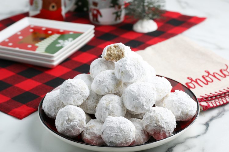 Snowball Cookies Recipe. It's not Christmas around our house until these cookies get baked. With a great nutty flavor sprinkled with powdered sugar, they will soon become a family favorite for you too.