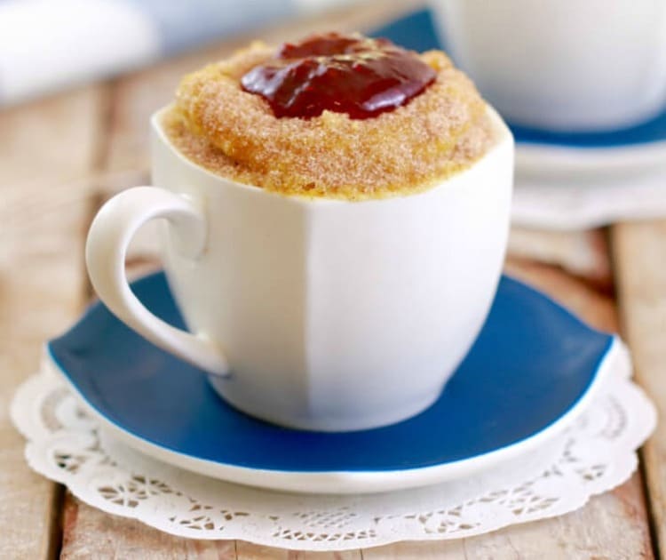 microwave mug snacks jelly donut in a white mug on a blue plate