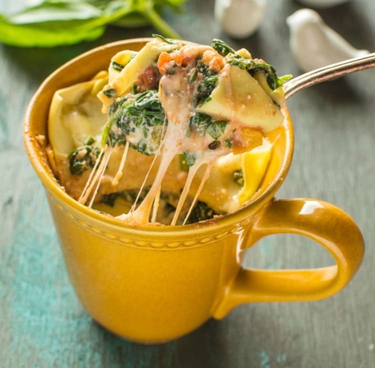 microwave mug snacks lasagna with spinach and ricotta in a yellow cup