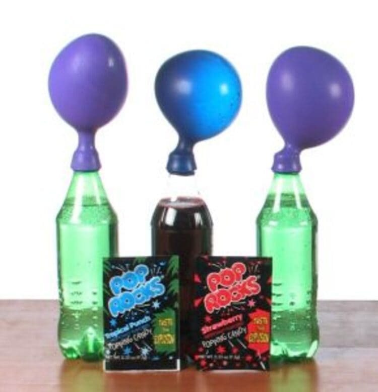 science project pop rocks expander, three bottles with balloons on them