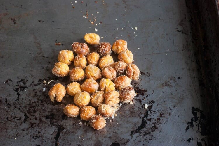 Roasted chickpeas recipe, chickpeas with seasoning on a black background