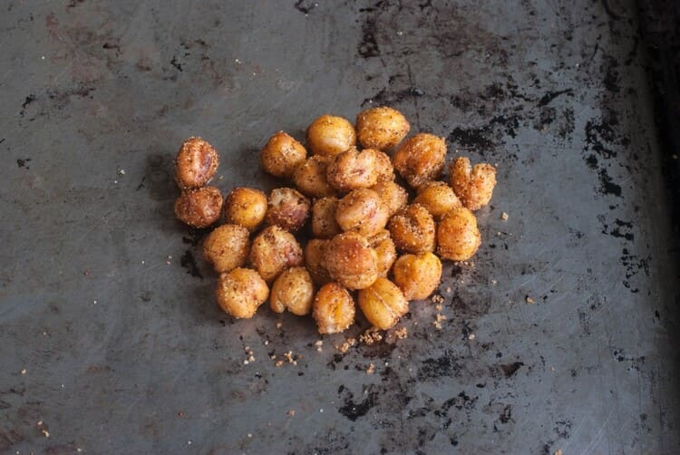 Roasted chickpeas recipe, chickpeas snack on a black background