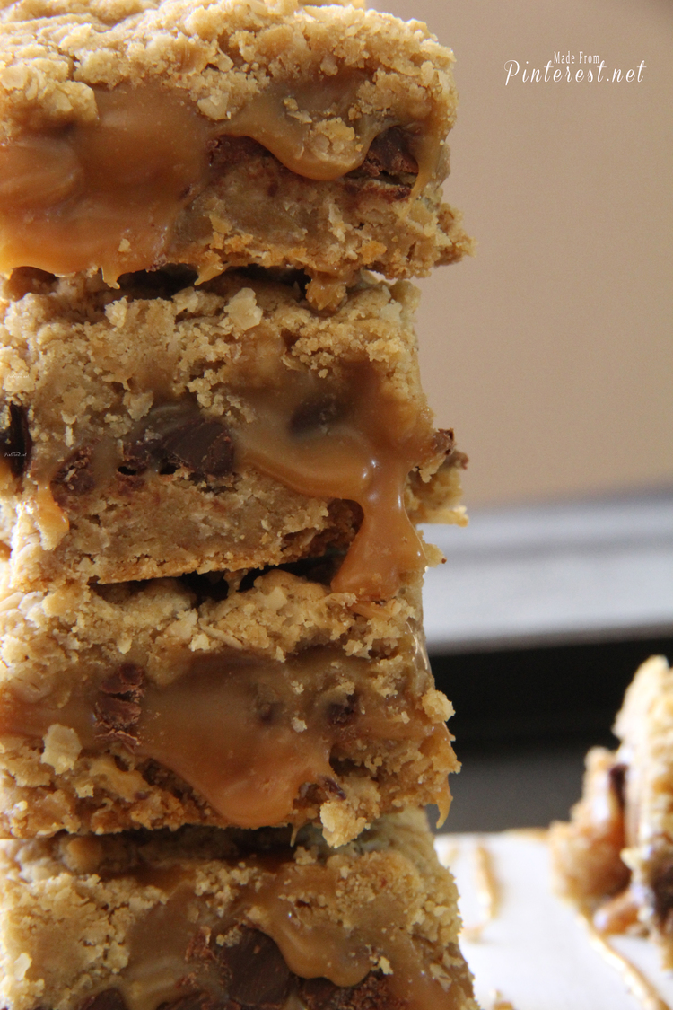 Carmelitas This Grandma Is Fun Close up of Carmelitas cookie bars stacked up on top of each other with caramel drizzled on plate (2)