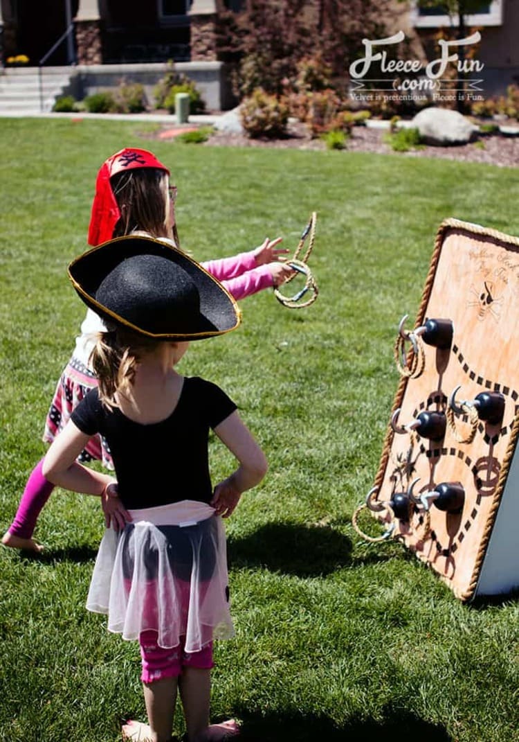 Captain Hook Ring Toss Pirate Party Activity With Two Kids Tossing Rings On The Board