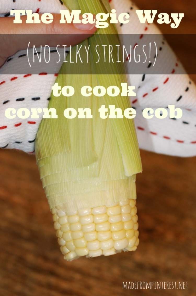 the magic way to cook corn on the cob (no silky strings!) a corn cob held in a towel