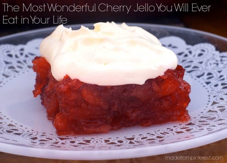 The Most Wonderful Cherry Jello You Will Ever Eat in Your Life. That's really the name of the recipe and it's the truth, a cherry jello on a white plate with cream on top