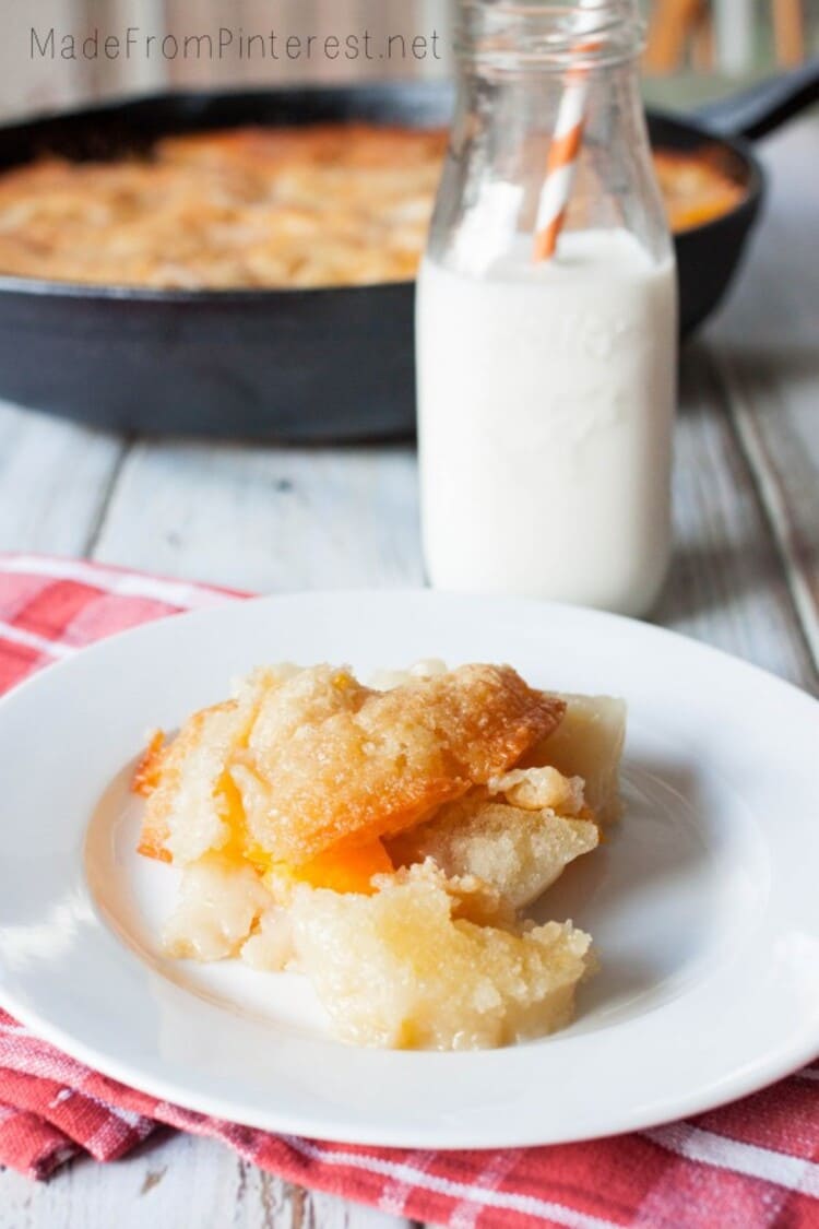 two two peach cobbler served with yoghurt on a plate