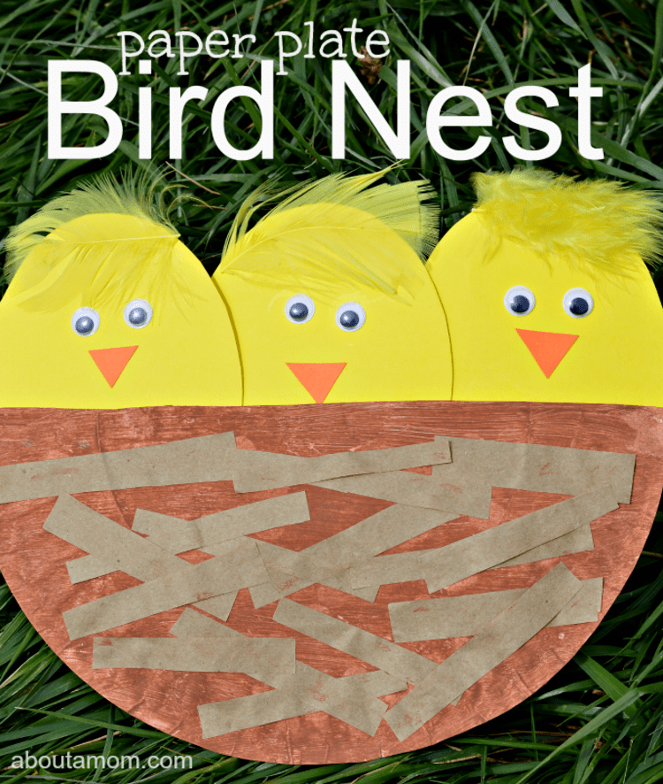 paper plate craft yellow birds in a brown nest on a black background