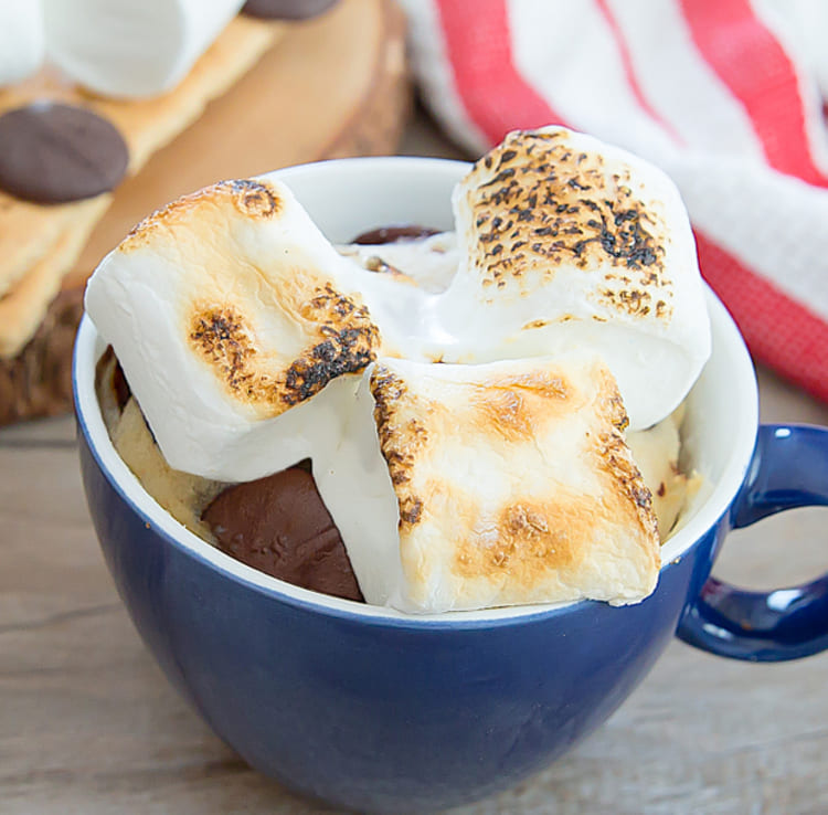 microwave mug cake smores in a blue cup with marshmallow on top